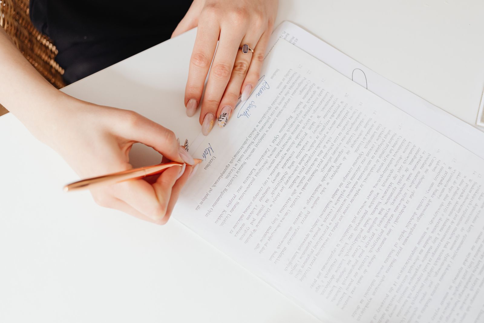 Refined hand writing with a rose-gold fountain pen — careful, professional attention to detail